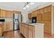 Well-equipped kitchen with stainless steel appliances, granite countertops, and an island at 11 Chad Ct, Mcdonough, GA 30253