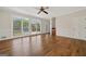 Living room with hardwood floors and large windows overlooking pool at 11 Chad Ct, Mcdonough, GA 30253