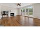 Living room featuring a fireplace, hardwood floors, and backyard view at 11 Chad Ct, Mcdonough, GA 30253