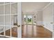Bright living room with hardwood floors and large bay windows offering scenic views at 11 Chad Ct, Mcdonough, GA 30253