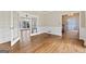 Bright living room with hardwood floors and glass doors leading to another room and pool at 11 Chad Ct, Mcdonough, GA 30253