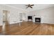 Spacious living room featuring a fireplace and hardwood floors at 11 Chad Ct, Mcdonough, GA 30253