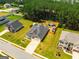 Beautiful aerial view of a home with a large backyard, mature trees, and an extended driveway at 845 Graeme Dr, Mcdonough, GA 30252
