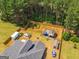 Aerial view of the property showcasing the expansive backyard, multiple entertaining areas, and wooded surroundings at 845 Graeme Dr, Mcdonough, GA 30252