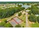 An aerial shot shows community tennis courts, a pool with lake access, and ample parking at 845 Graeme Dr, Mcdonough, GA 30252