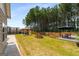 Expansive backyard featuring a variety of entertainment areas, including a deck, hot tub, and putting green at 845 Graeme Dr, Mcdonough, GA 30252