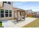 Backyard featuring a porch swing, concrete patio, privacy fence, and a hot tub at 845 Graeme Dr, Mcdonough, GA 30252