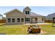 Charming backyard featuring an elegant water fountain and meticulously maintained lawn at 845 Graeme Dr, Mcdonough, GA 30252
