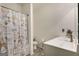 Bright bathroom featuring a toilet, vanity with sink, and a Paris-themed shower curtain at 845 Graeme Dr, Mcdonough, GA 30252