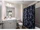 Fresh bathroom featuring a white vanity, toilet, mirror, and Eiffel Tower-themed shower curtain at 845 Graeme Dr, Mcdonough, GA 30252