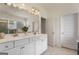 Bathroom features double sinks, modern fixtures, and white cabinets at 845 Graeme Dr, Mcdonough, GA 30252