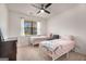 Bedroom features twin beds, natural light, and neutral decor at 845 Graeme Dr, Mcdonough, GA 30252