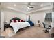 Spacious bedroom features a tray ceiling, ceiling fan, and ample natural light at 845 Graeme Dr, Mcdonough, GA 30252