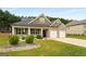 Beautiful brick home features a manicured lawn and attached two car garage at 845 Graeme Dr, Mcdonough, GA 30252