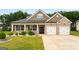 Beautiful brick home features a manicured lawn and attached two car garage at 845 Graeme Dr, Mcdonough, GA 30252