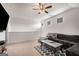 Relaxing living room featuring a comfy sectional sofa, ceiling fan, and natural light at 845 Graeme Dr, Mcdonough, GA 30252