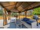 Comfortable outdoor living area with a cozy seating area and a grill for outdoor cooking at 845 Graeme Dr, Mcdonough, GA 30252
