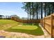 Beautiful backyard putting green with sand trap and room to practice your putting skills at 845 Graeme Dr, Mcdonough, GA 30252