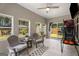 Bright sunroom featuring multiple windows, comfortable seating, tile floors, and outdoor views at 845 Graeme Dr, Mcdonough, GA 30252