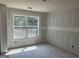 Unfinished bedroom showcasing a large window and natural light at 5565 Hwy 155, Stockbridge, GA 30281