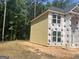 Exterior view showing the side of a two story home with siding and windows at 5565 Hwy 155, Stockbridge, GA 30281