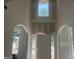 Bright foyer featuring a window above the front door, arched entryways, and neutral walls awaiting personalization at 5565 Hwy 155, Stockbridge, GA 30281