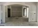 Open living space with arched doorways, offering a versatile layout for personalization at 5565 Hwy 155, Stockbridge, GA 30281