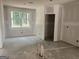 Bright room with a large window, adjacent to a doorway, providing seamless transition at 5565 Hwy 155, Stockbridge, GA 30281