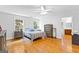 Comfortable bedroom featuring hardwood floors, ample natural light, and neutral decor at 152 Bear Creek Rd, Moreland, GA 30259