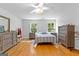 Inviting bedroom with hardwood floors, calming colors, and plenty of natural light at 152 Bear Creek Rd, Moreland, GA 30259