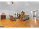 Bright living room featuring vaulted ceilings, hardwood floors, and comfortable seating at 152 Bear Creek Rd, Moreland, GA 30259