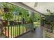 Relaxing porch featuring potted plants, rocking chairs, and view of lush greenery at 152 Bear Creek Rd, Moreland, GA 30259
