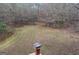 Large backyard area with a chimney in view, perfect for outdoor activities at 145 Mill Run, Fayetteville, GA 30214