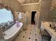Upscale bathroom with a freestanding tub, walk-in shower, and dual vanities at 145 Mill Run, Fayetteville, GA 30214