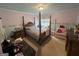 Bedroom with wood bed frame, dresser, and decor at 145 Mill Run, Fayetteville, GA 30214