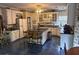 Spacious kitchen with white cabinets, center island, and tile flooring at 145 Mill Run, Fayetteville, GA 30214