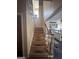 Staircase with wood steps and white railing at 145 Mill Run, Fayetteville, GA 30214