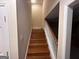 Staircase with wood steps and white railing at 145 Mill Run, Fayetteville, GA 30214