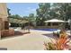 Backyard with a covered patio, outdoor seating and a sparkling blue pool at 234 Crumbley Rd, Mcdonough, GA 30252
