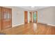 Bedroom features include hardwood floors, neutral walls, and wood doors at 234 Crumbley Rd, Mcdonough, GA 30252