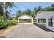 A detached open carport and long driveway offer plenty of parking at 234 Crumbley Rd, Mcdonough, GA 30252