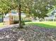 A charming exterior view of a home with stone accents, white trim, and a well-manicured lawn at 234 Crumbley Rd, Mcdonough, GA 30252