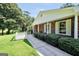 Charming brick home with a long driveway, manicured bushes, and a covered entryway at 234 Crumbley Rd, Mcdonough, GA 30252