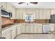 Well-appointed kitchen with granite countertops, custom cabinets, stainless steel appliances at 234 Crumbley Rd, Mcdonough, GA 30252