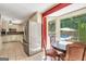Spacious kitchen with stainless steel fridge, pool view, and dining area at 234 Crumbley Rd, Mcdonough, GA 30252