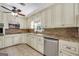 Open kitchen with stone countertops and backsplash, stainless steel appliances and white cabinets at 234 Crumbley Rd, Mcdonough, GA 30252