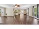 Open-concept living room with hardwood floors and lots of natural light at 234 Crumbley Rd, Mcdonough, GA 30252