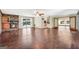 Spacious living room featuring a brick fireplace and sliding glass doors to the pool at 234 Crumbley Rd, Mcdonough, GA 30252