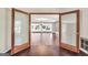 Open-concept living and dining room with hardwood floors and doors opening to the outdoors at 234 Crumbley Rd, Mcdonough, GA 30252