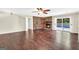 Living room featuring a brick fireplace and sliding glass doors to the backyard pool at 234 Crumbley Rd, Mcdonough, GA 30252